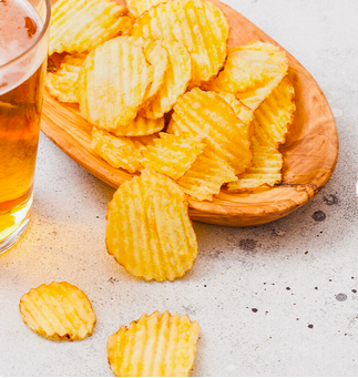 Fried big wave potato chips snack in bulk.Potato Chips French fries puffed food Production Line Potato Chips