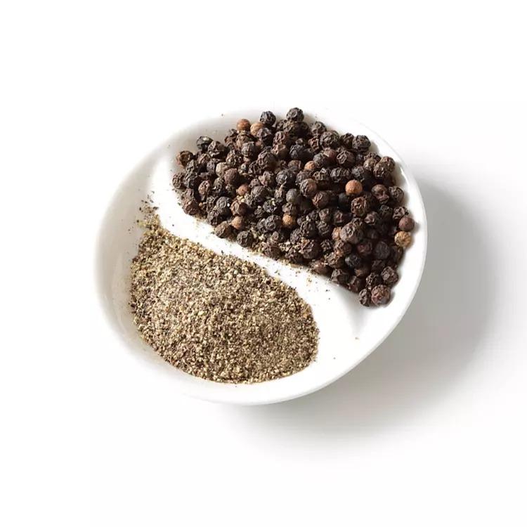 Whole black pepper for grinding fresh spices in kitchens Organic black pepper produced without chemicals or additives Black pepper for cooking curries soups and traditional dishes Fresh black pepper packed hygienically for long shelf life